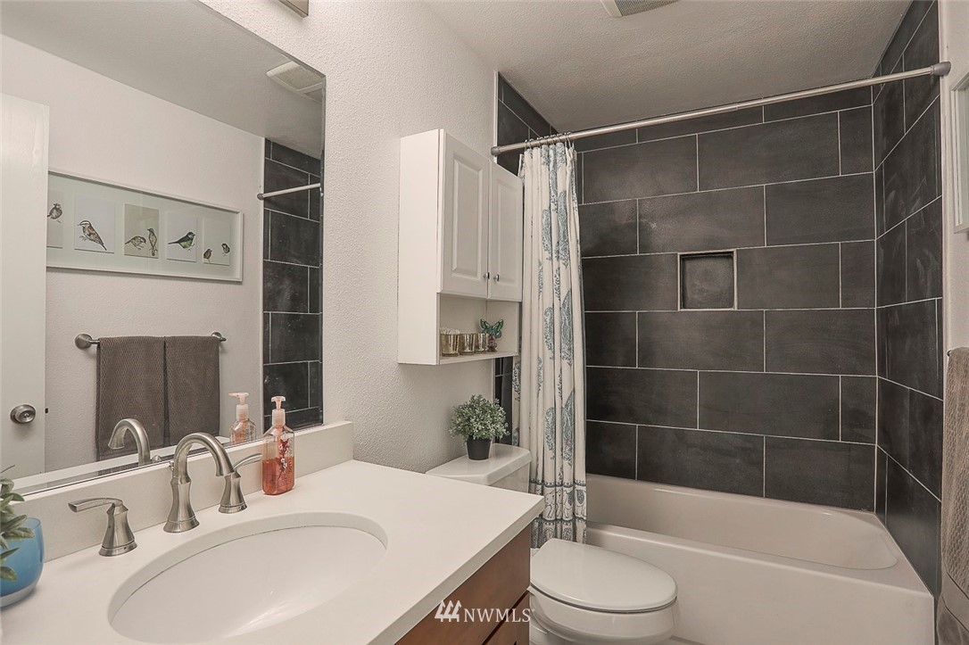 21314 2nd Avenue Southeast Bothell, WA 98021 - Photo 18 of 25 a bathroom with a sink toilet and shower