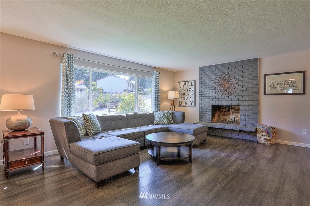 21314 2nd Avenue Southeast Bothell, WA 98021 - Photo 3 of 25 a living room with furniture and a fireplace