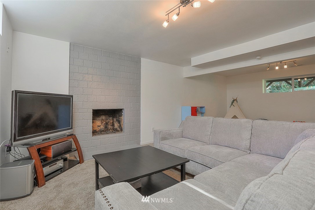 21314 2nd Avenue Southeast Bothell, WA 98021 - Photo 21 of 25 a living room with furniture and a flat screen tv