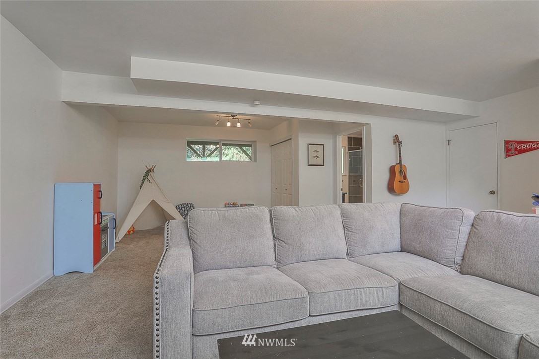 21314 2nd Avenue Southeast Bothell, WA 98021 - Photo 22 of 25 a living room with furniture and a window