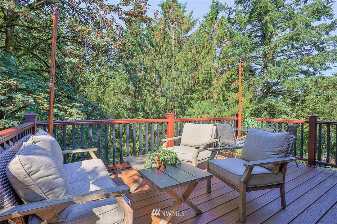 21314 2nd Avenue Southeast Bothell, WA 98021 - Photo 24 of 25 a balcony with wooden floor and outdoor seating