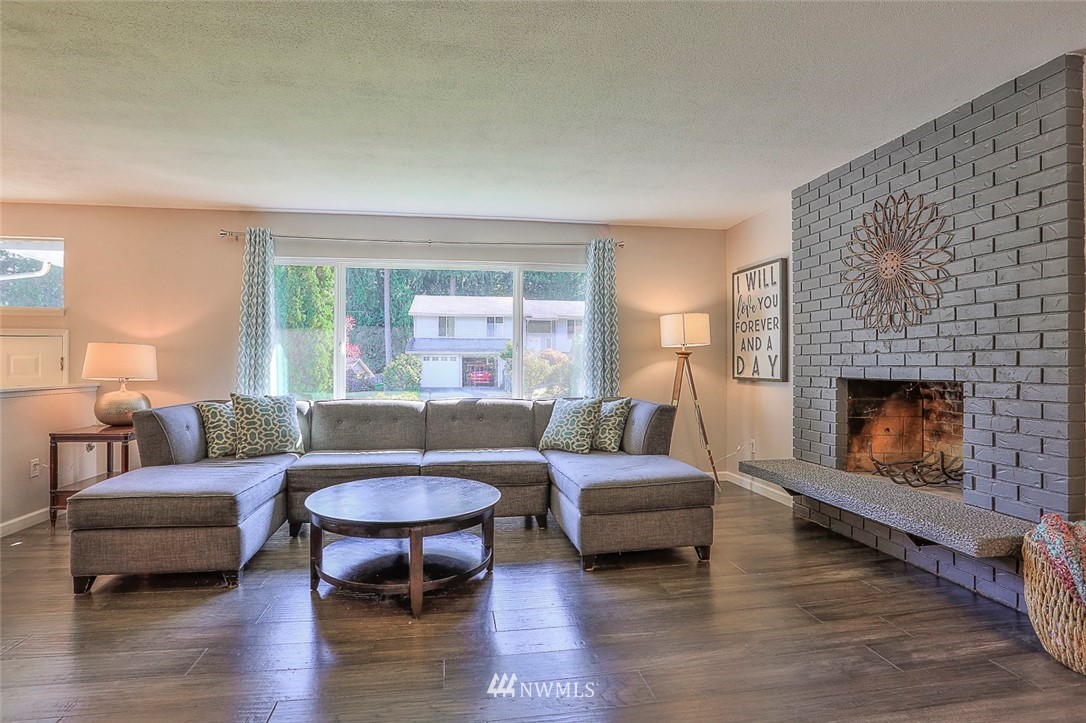 21314 2nd Avenue Southeast Bothell, WA 98021 - Photo 4 of 25 a living room with furniture and a fireplace
