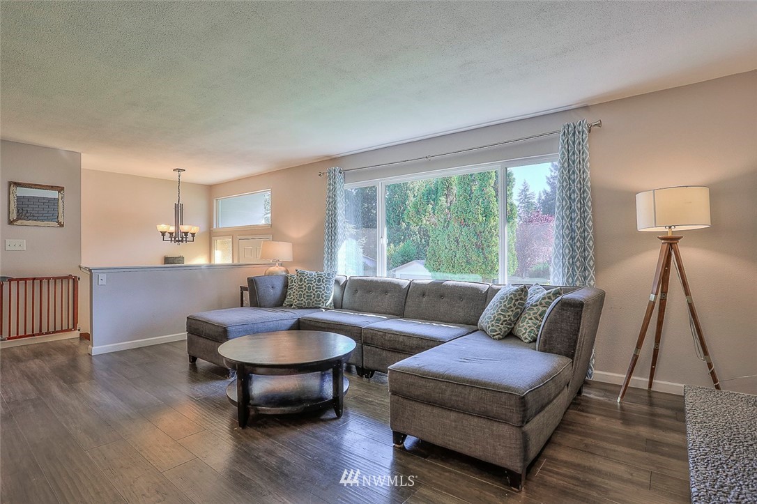 21314 2nd Avenue Southeast Bothell, WA 98021 - Photo 5 of 25 a living room with furniture and a wooden floor