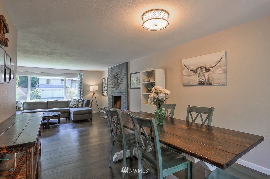 21314 2nd Avenue Southeast Bothell, WA 98021 - Photo 6 of 25 a view of a dining room with furniture window and wooden floor