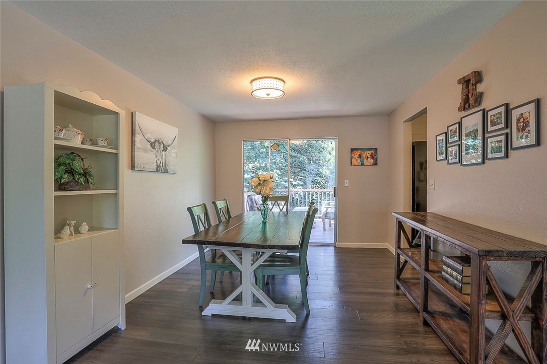 21314 2nd Avenue Southeast Bothell, WA 98021 - Photo 8 of 25 a view of a dining room with furniture window and wooden floor
