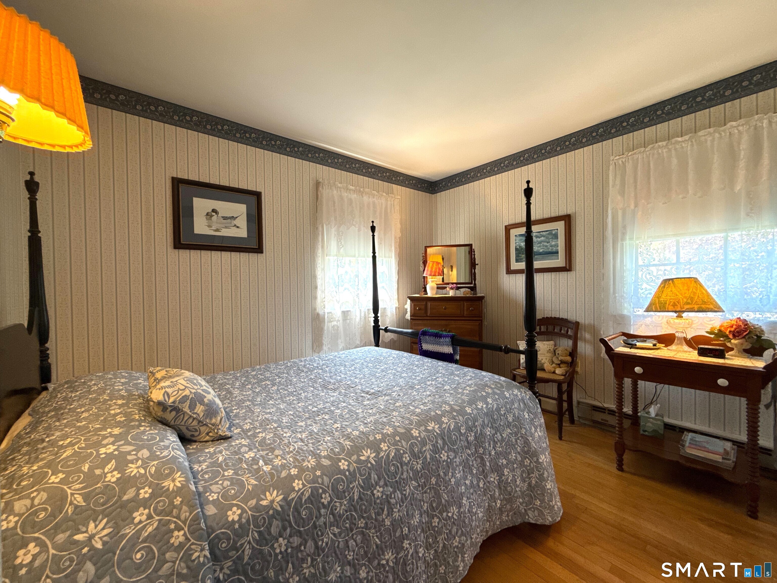 15 Grove Street Deep River, CT 06417 - Photo 15 of 25 a bedroom with a bed and a lamp on dresser