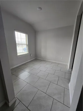 a view of an empty room and window