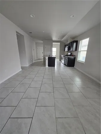 a view of a livingroom with furniture and windows