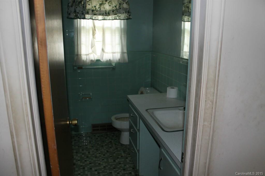 116 Terrace Road Mooresville, NC 28117 - Photo 9 of 12 a bathroom with a granite countertop sink toilet and shower