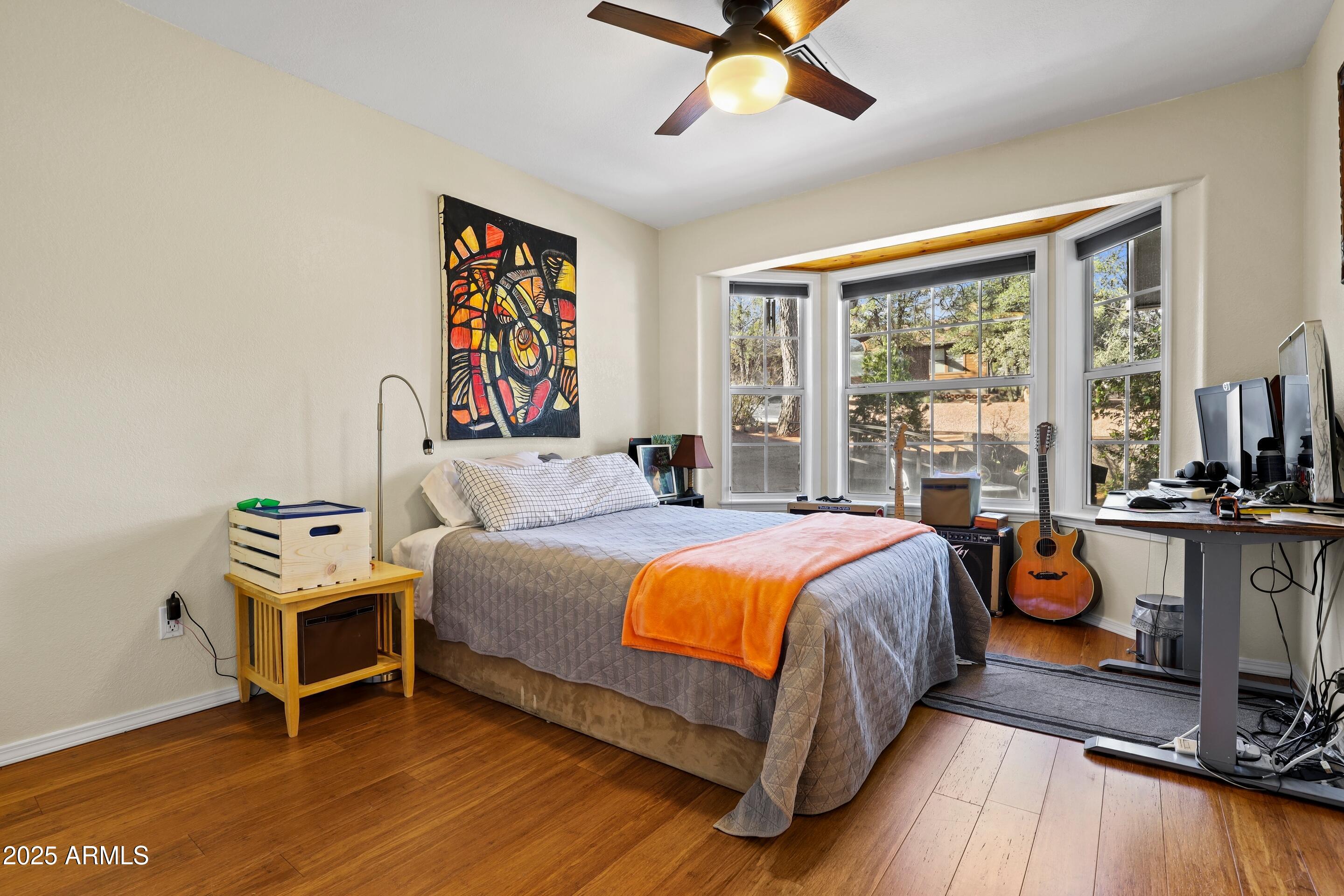 905 South Coronado Way Payson, AZ 85541 - Photo 17 of 33 a bedroom with a bed and a chandelier