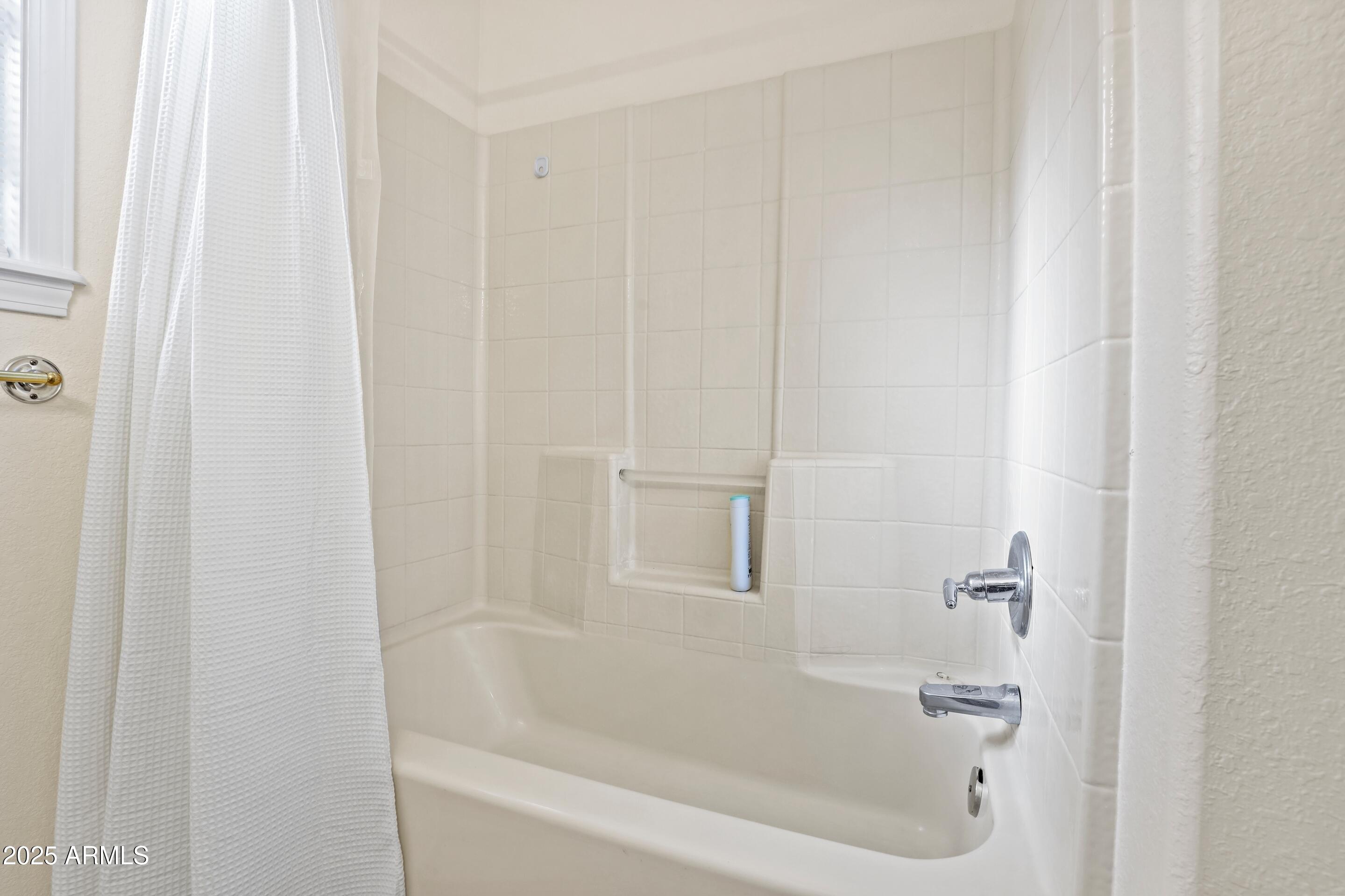 905 South Coronado Way Payson, AZ 85541 - Photo 20 of 33 a close up of a bathtub curtain