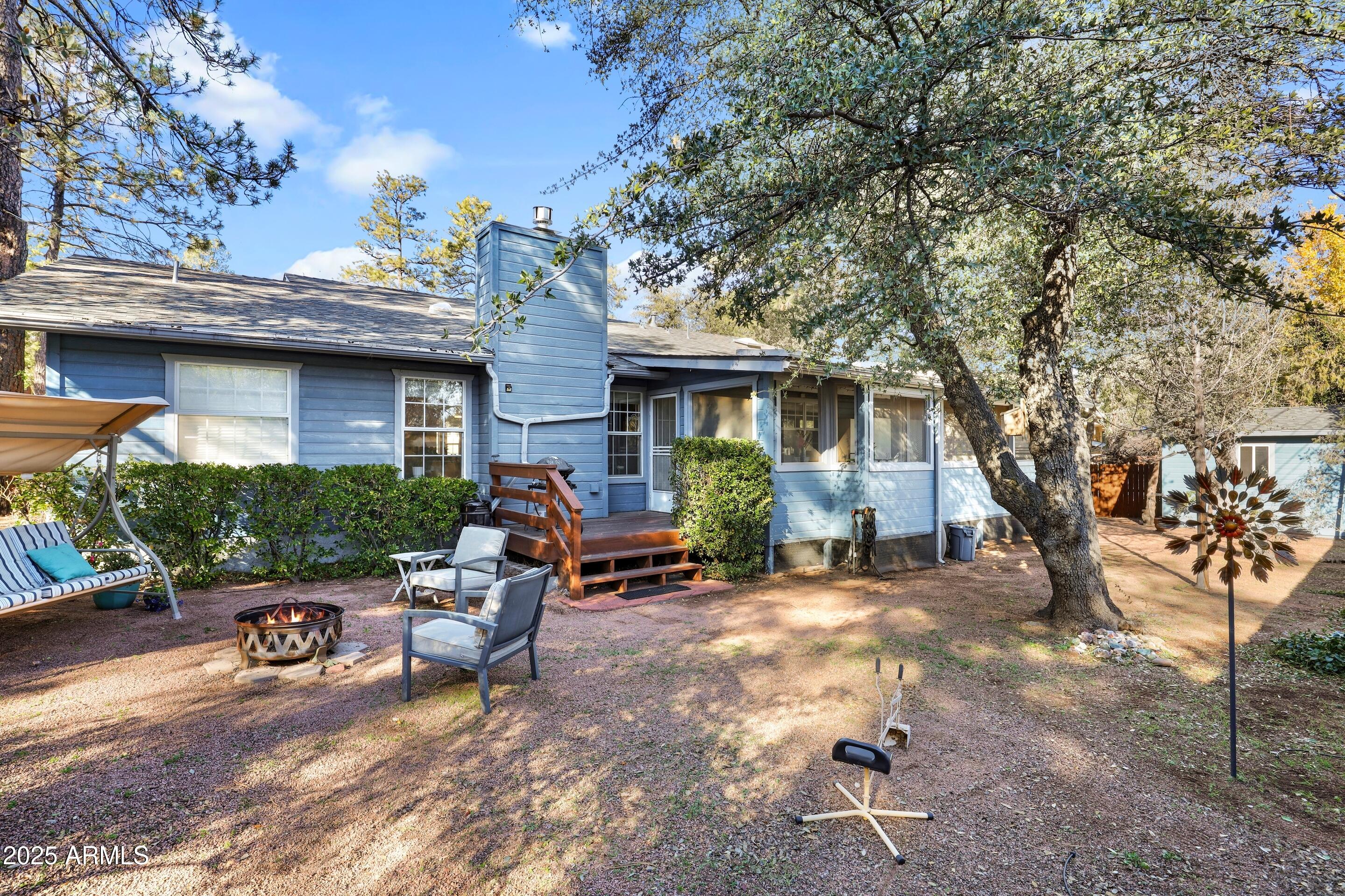 905 South Coronado Way Payson, AZ 85541 - Photo 24 of 33 a view of a patio with a table and chairs under an umbrella