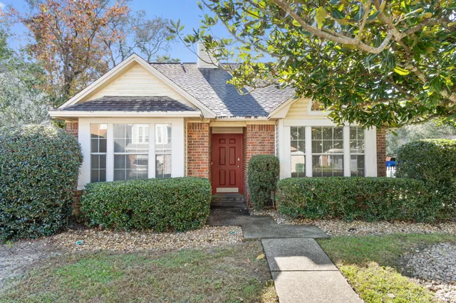 front view of a house and a yard