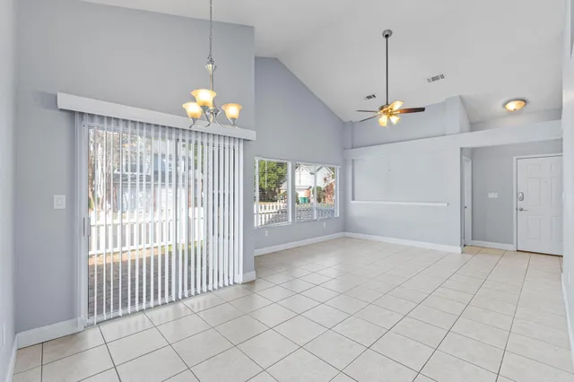 a view of an empty room with a window