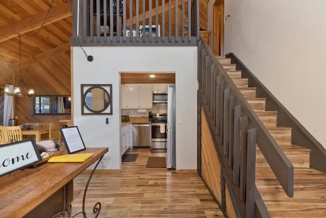 a view of a livingroom with furniture and entryway