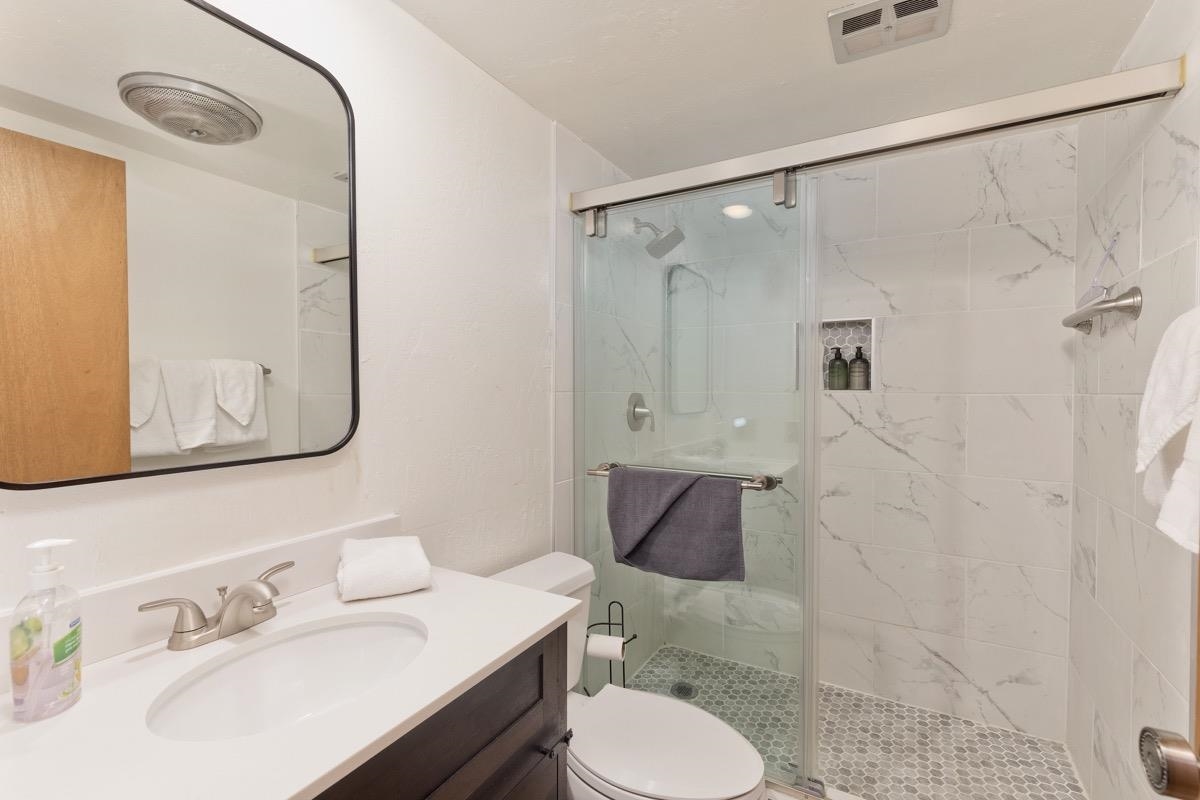 175 Mammoth Slopes Drive, Unit 3 Mammoth Lakes, CA 93546 - Photo 23 of 30 a bathroom with a sink toilet and shower
