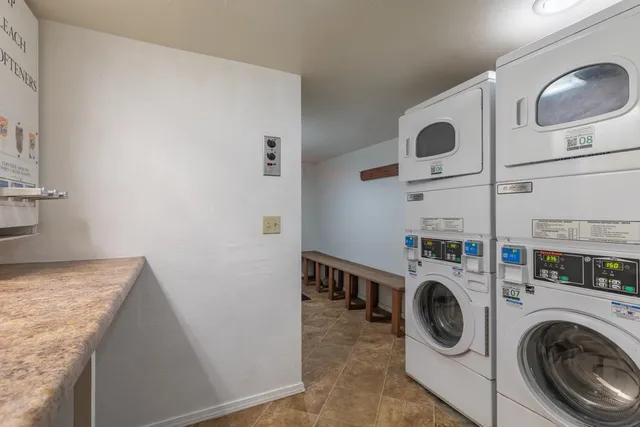 a view of a storage and utility room with washer and dryer