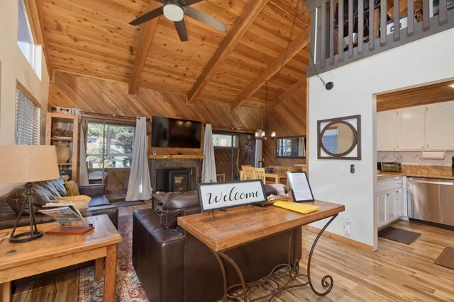 a living room with fireplace furniture and a fireplace