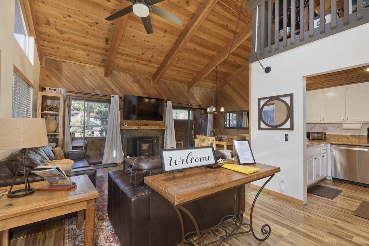 175 Mammoth Slopes Drive, Unit 3 Mammoth Lakes, CA 93546 - Photo 3 of 30 a living room with fireplace furniture and a fireplace
