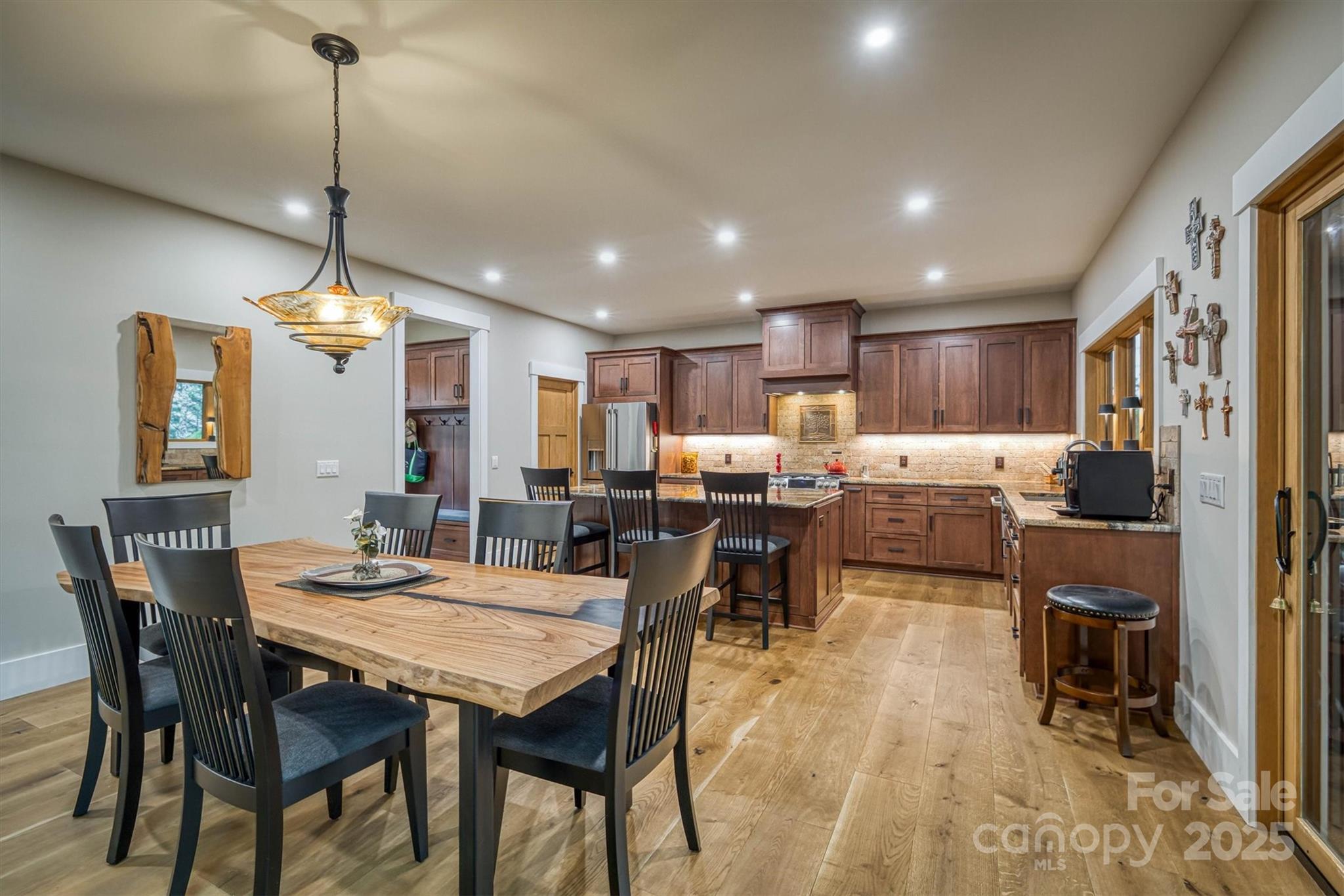 2116 October Drive, Unit 146 Nebo, NC 28761 - Photo 11 of 45 a kitchen with kitchen island a dining table chairs stainless steel appliances and cabinets