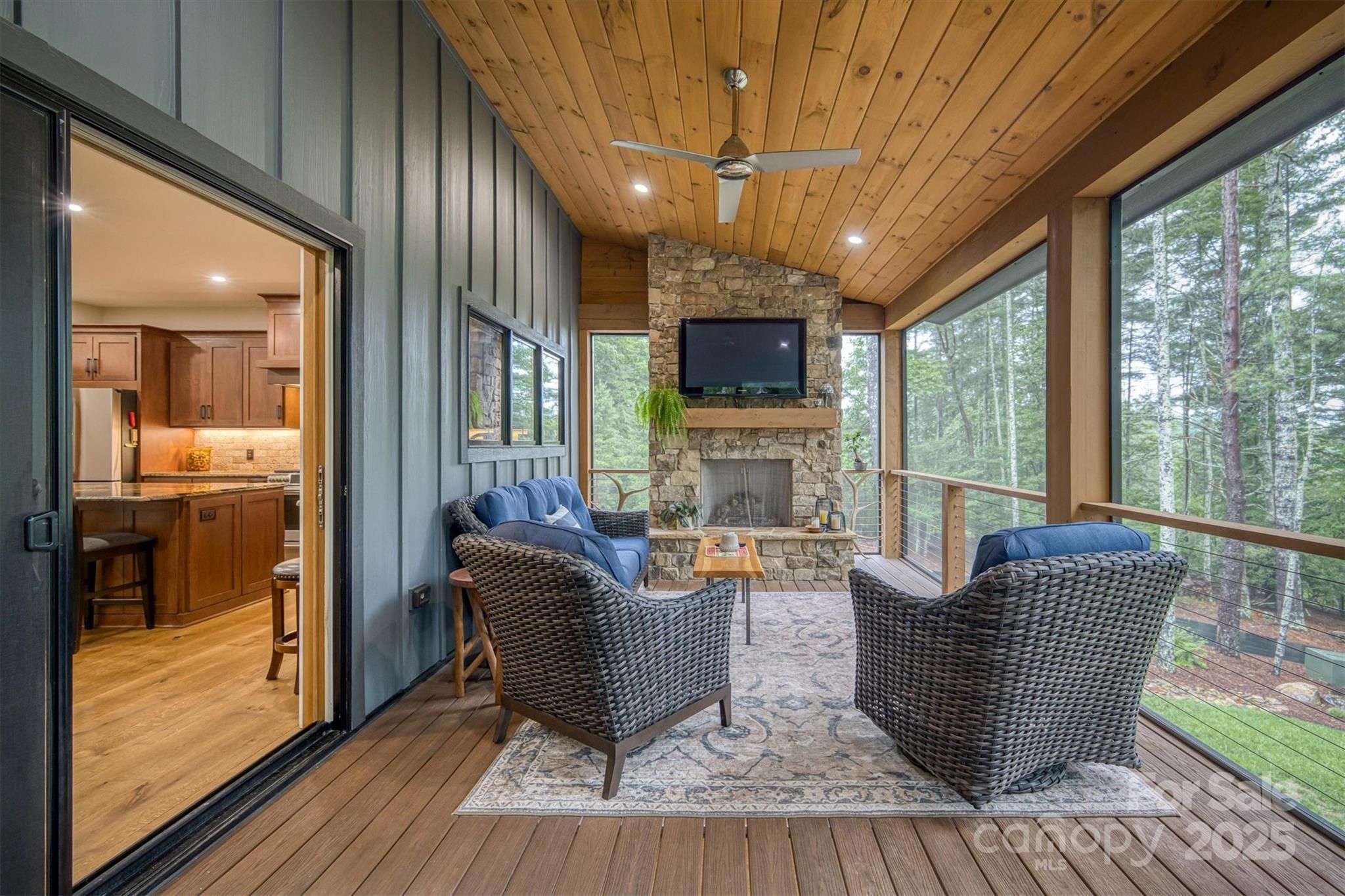 2116 October Drive, Unit 146 Nebo, NC 28761 - Photo 19 of 45 a living room with fireplace furniture and a flat screen tv