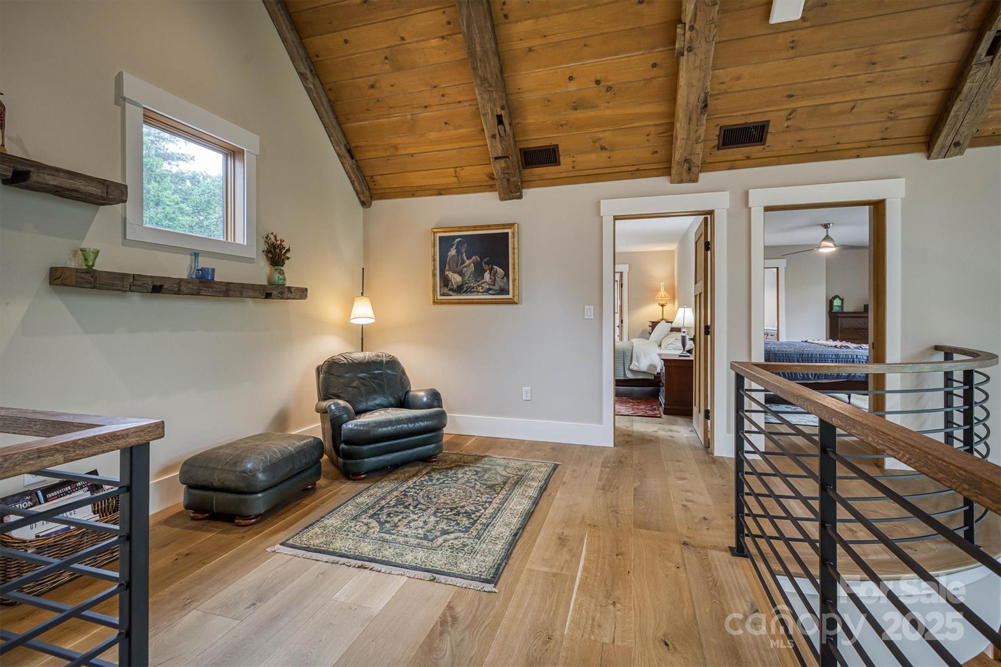 2116 October Drive, Unit 146 Nebo, NC 28761 - Photo 21 of 45 a bedroom with furniture and a wooden floor