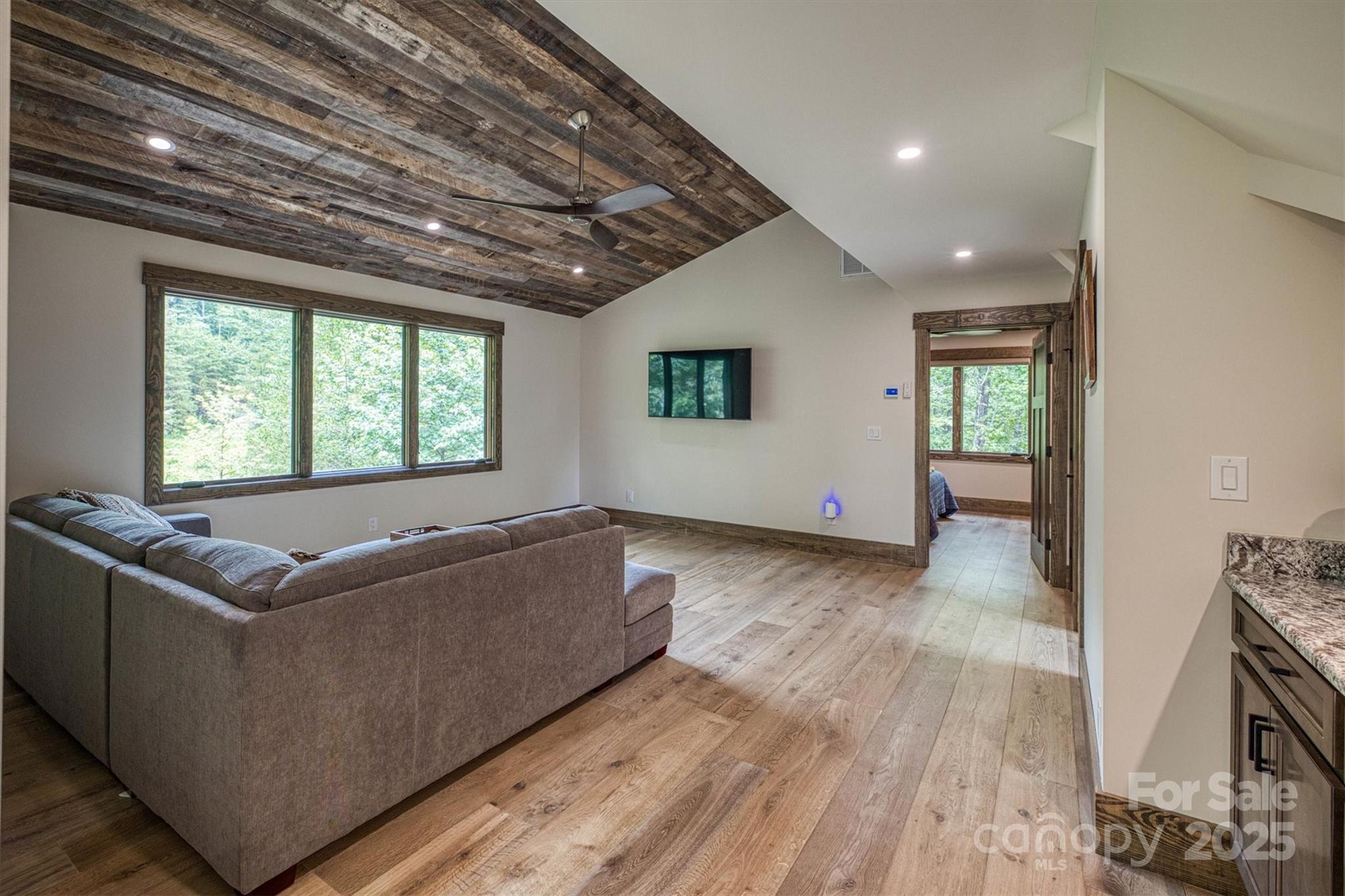 2116 October Drive, Unit 146 Nebo, NC 28761 - Photo 36 of 45 a living room with furniture and a wooden floor