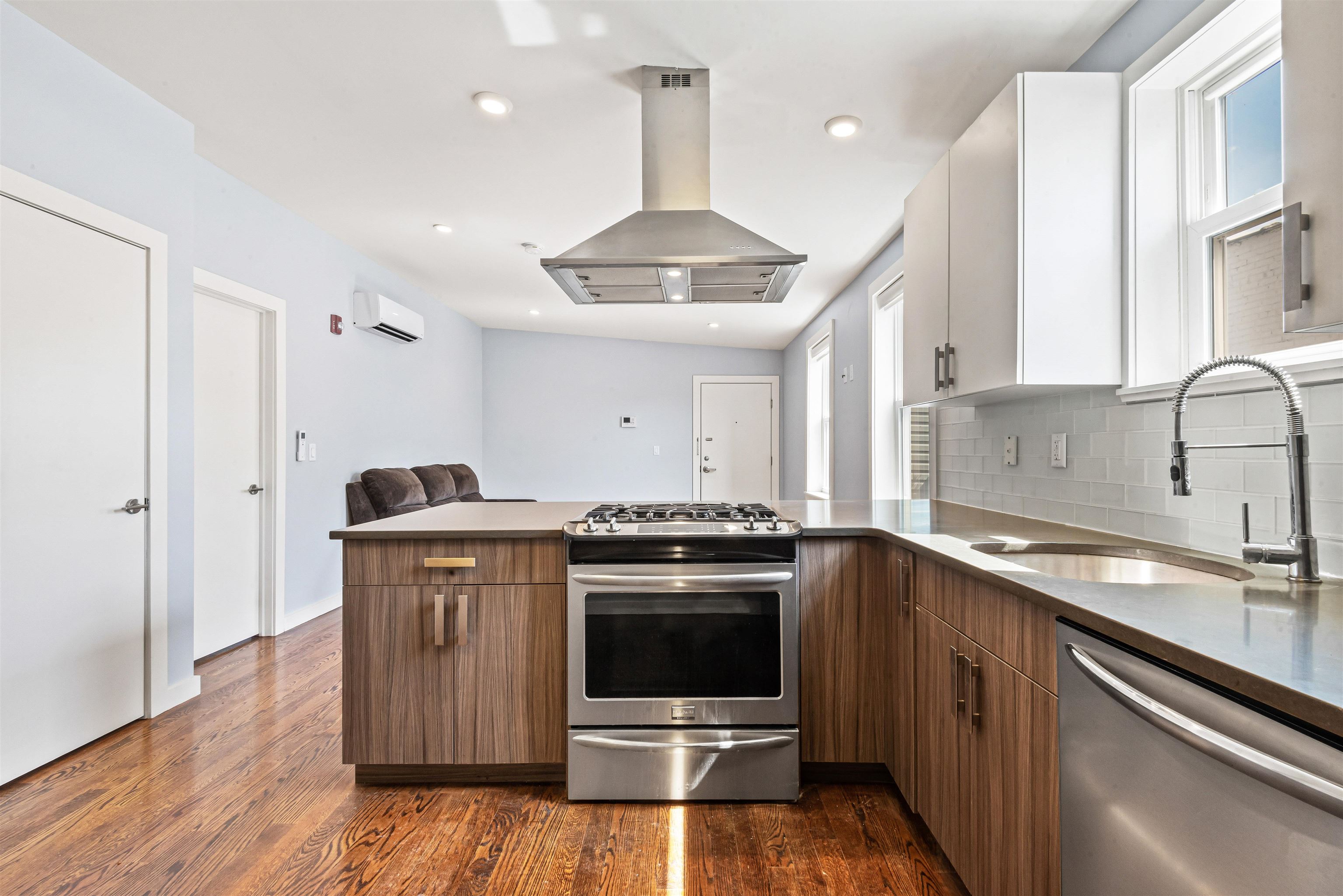 102 Colgate Street, Unit 302 Jersey City, NJ 07302 - Photo 1 of 21 a kitchen with a stove and a sink