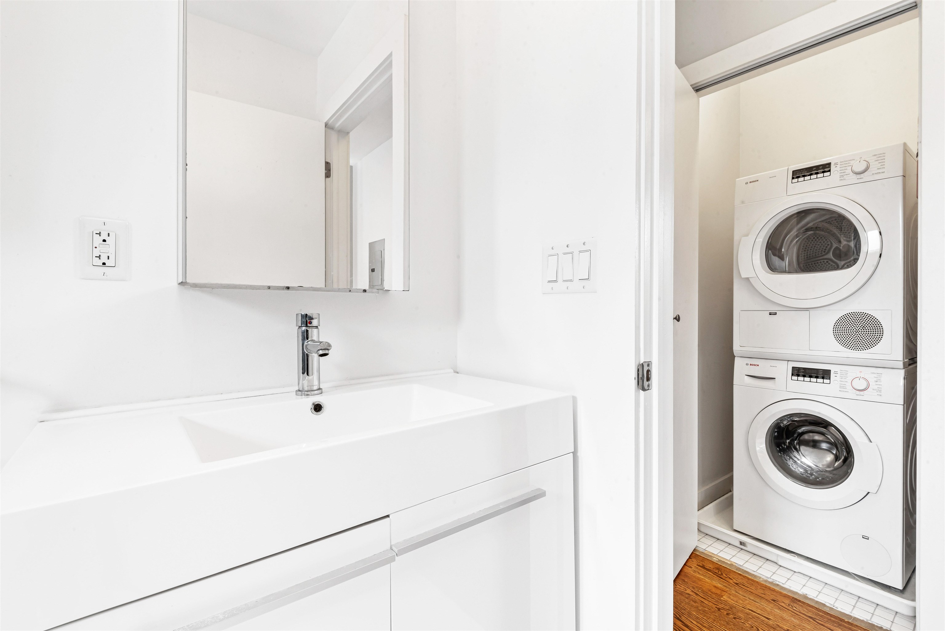 102 Colgate Street, Unit 302 Jersey City, NJ 07302 - Photo 14 of 21 a utility room with sink dryer and washer