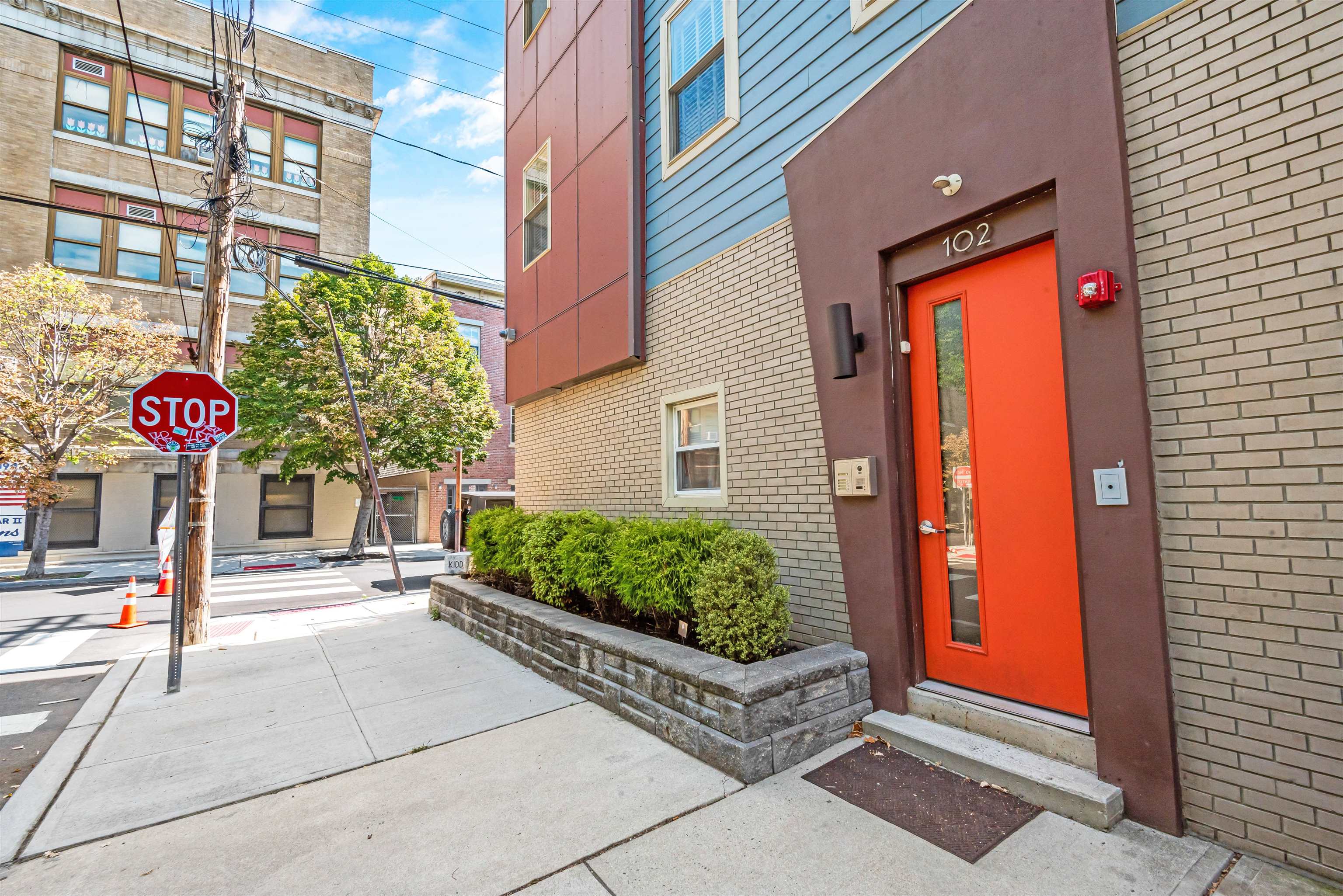 102 Colgate Street, Unit 302 Jersey City, NJ 07302 - Photo 3 of 21 a front view of a building with outdoor area