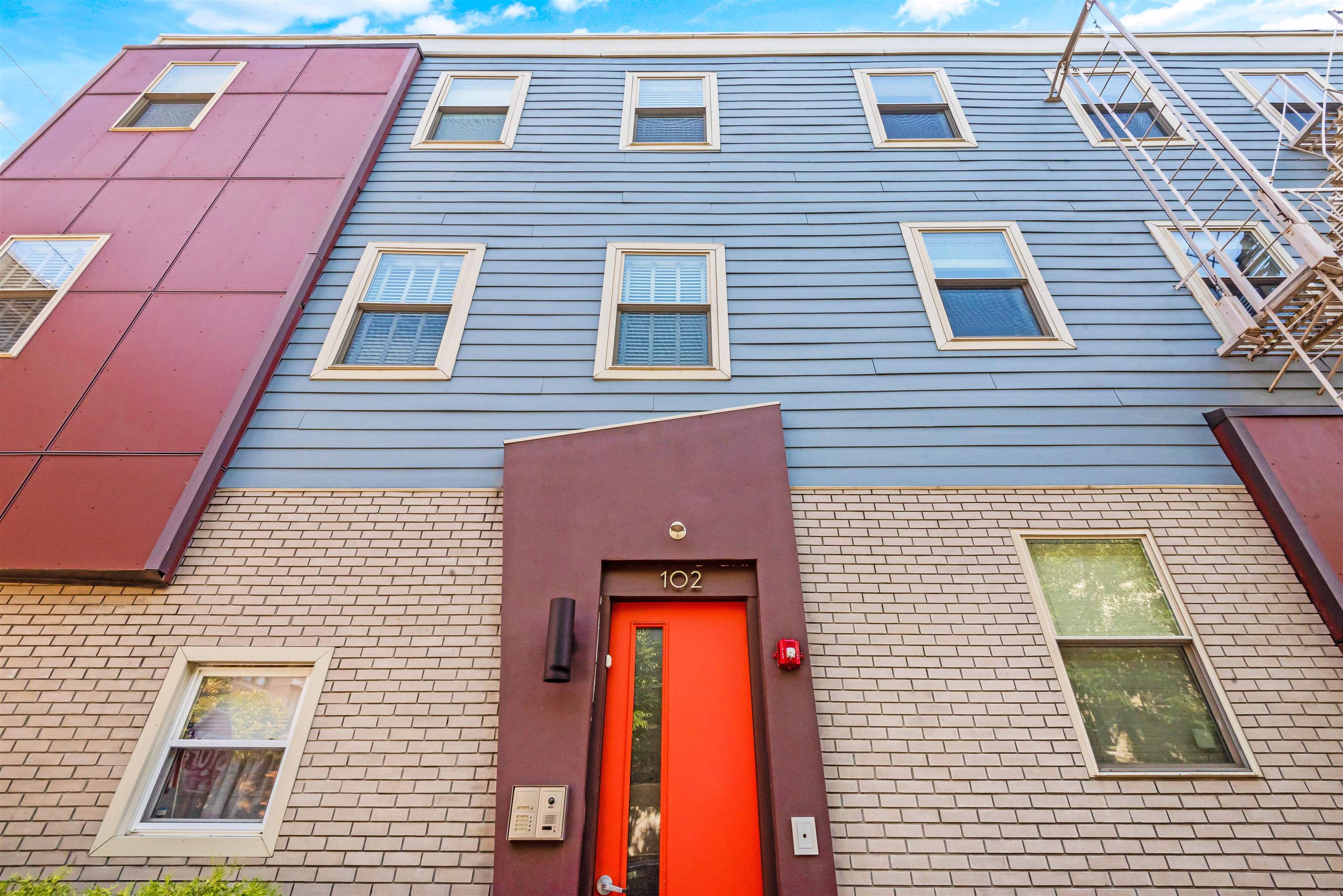 102 Colgate Street, Unit 302 Jersey City, NJ 07302 - Photo 4 of 21 a brick building with a large window