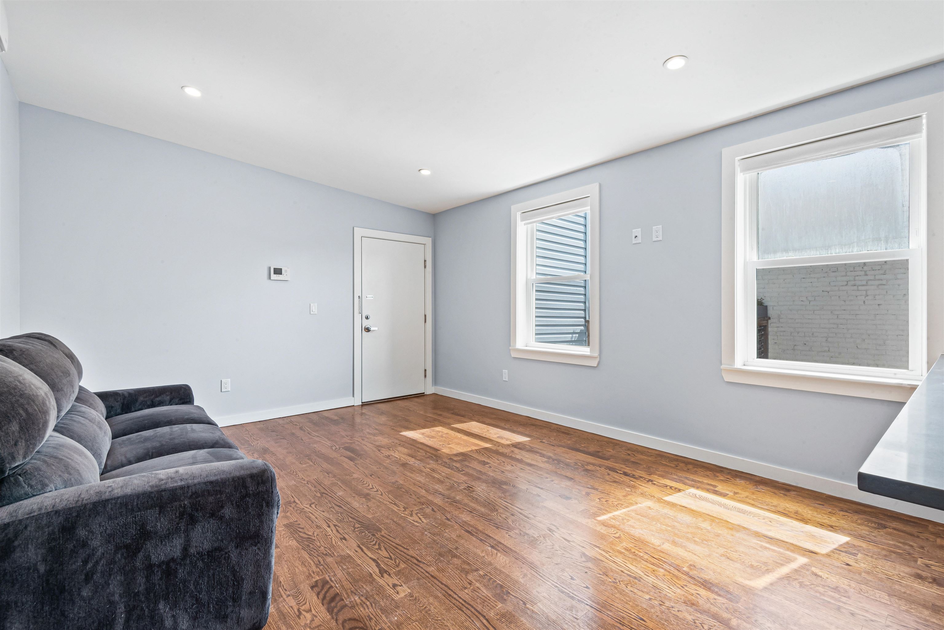102 Colgate Street, Unit 302 Jersey City, NJ 07302 - Photo 9 of 21 a bedroom with furniture and a window
