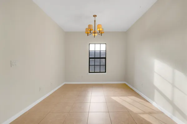 a view of an empty room with windows