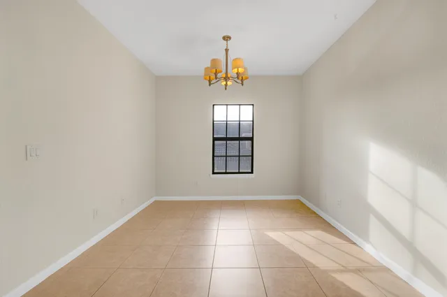 a view of an empty room with windows