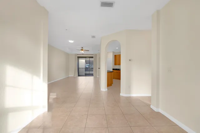 a view of a hallway with a kitchen
