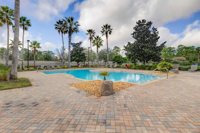 a view of a swimming pool and a yard