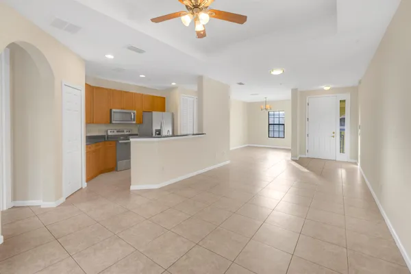 a view of a kitchen with a sink and cabinets