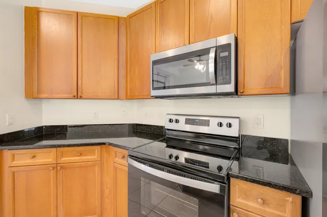 a kitchen with a stove and a microwave