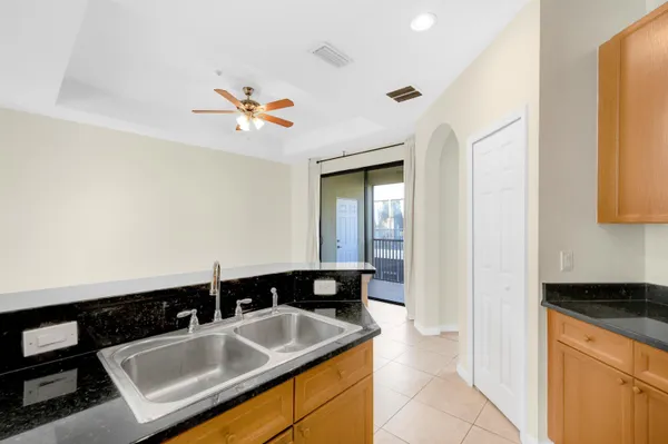 a kitchen with a sink and a refrigerator