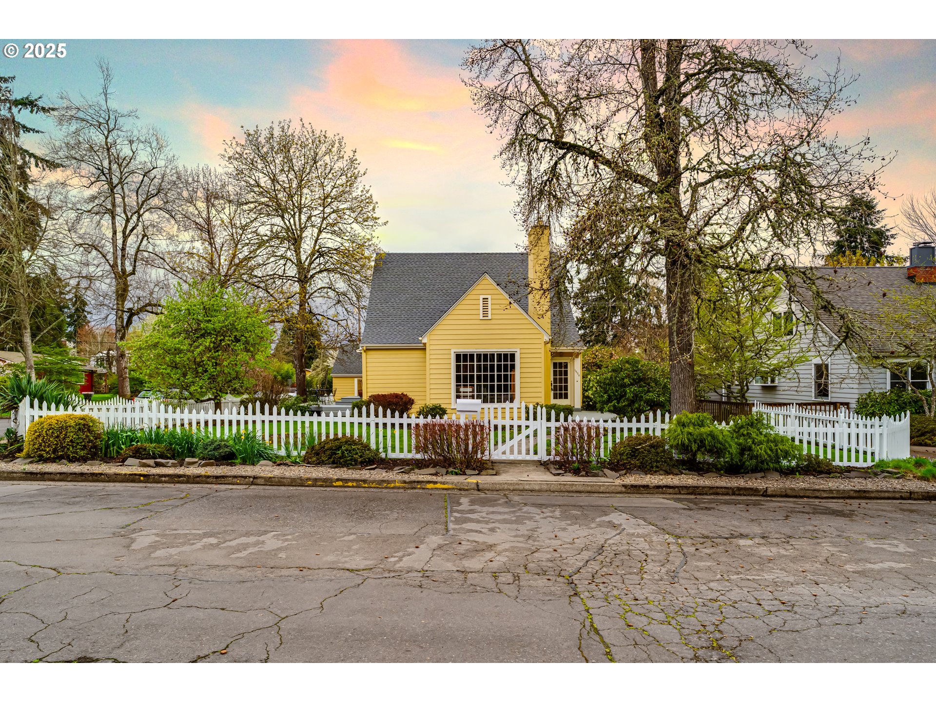 1996 Monroe Street Eugene, OR 97405 - Photo 2 of 47 a front view of a house with a garden and plants
