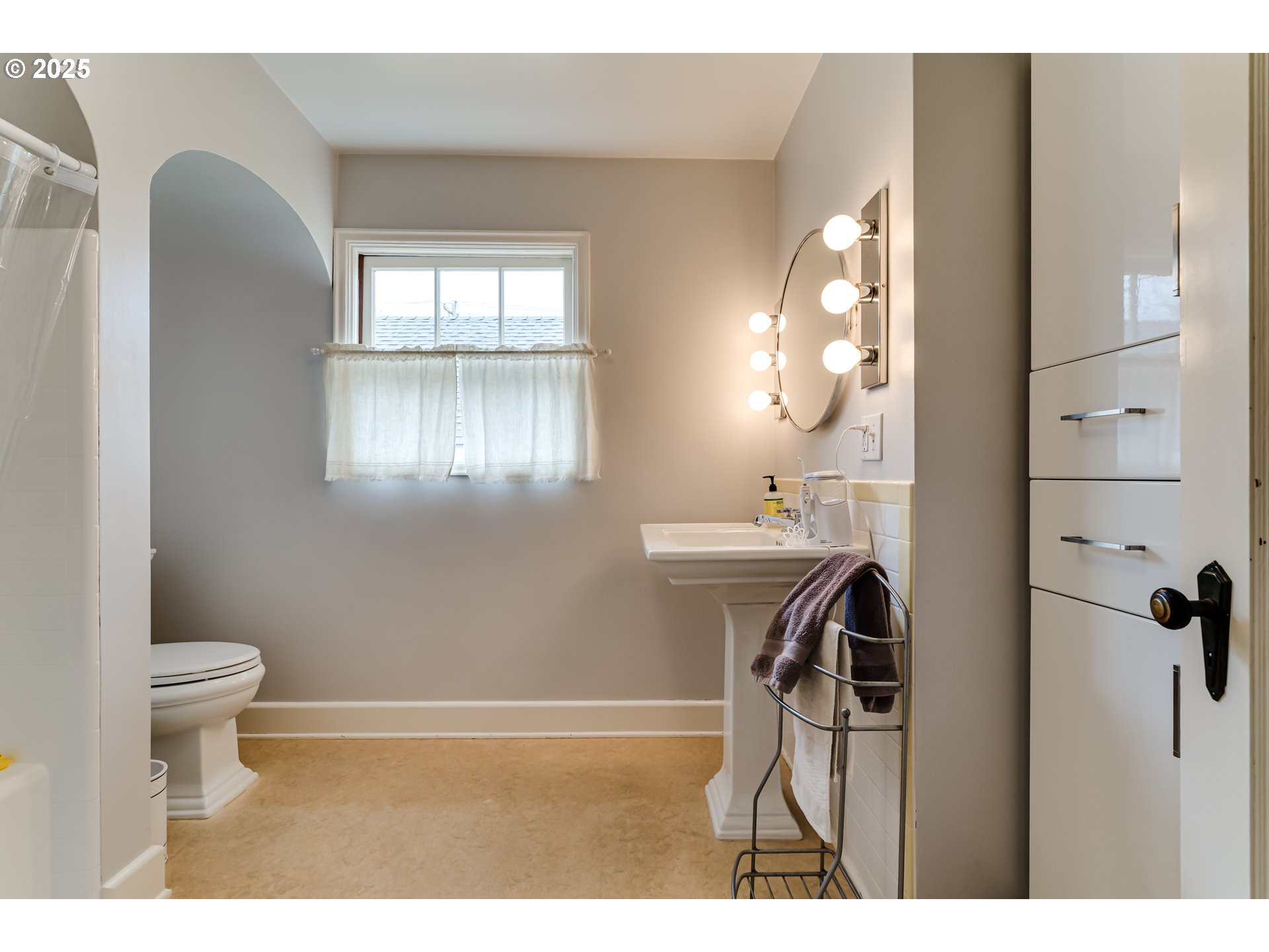 1996 Monroe Street Eugene, OR 97405 - Photo 21 of 47 a bathroom with a sink a toilet and a mirror