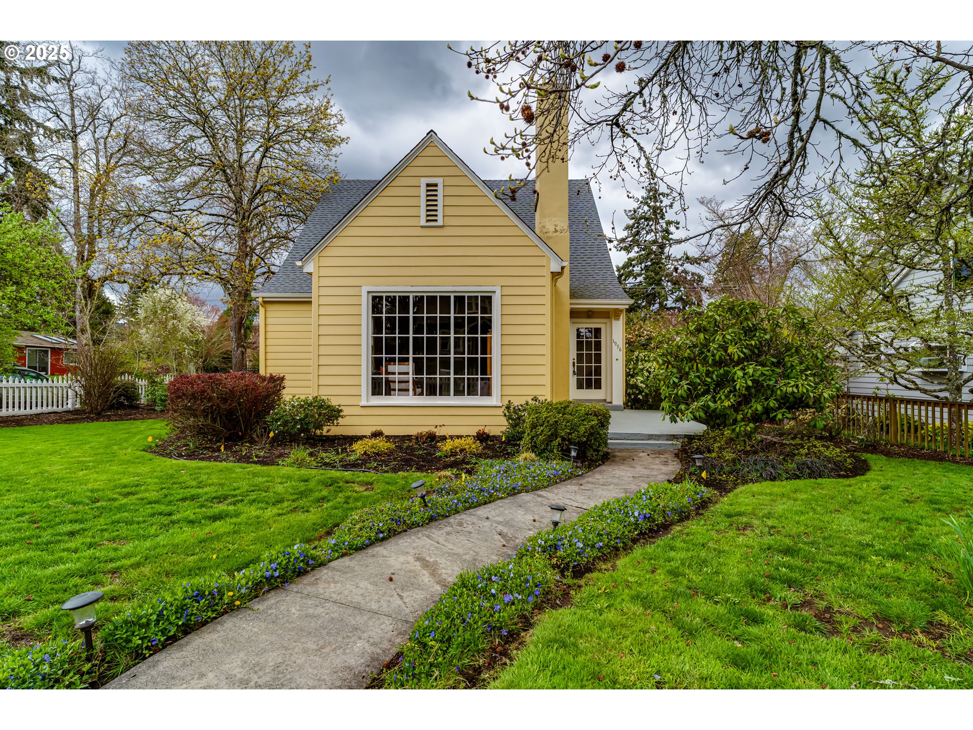 1996 Monroe Street Eugene, OR 97405 - Photo 3 of 47 a front view of a house with a yard