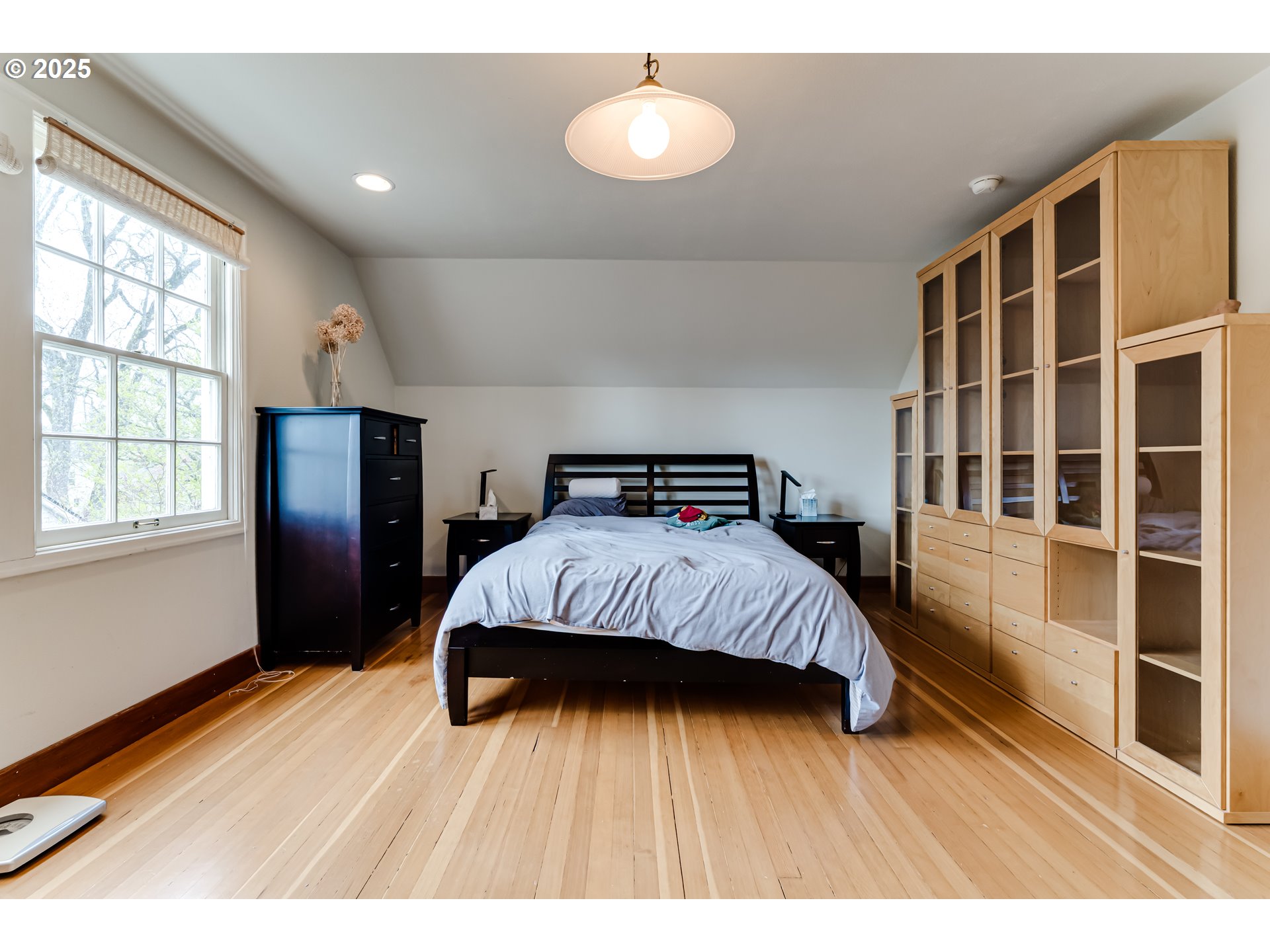 1996 Monroe Street Eugene, OR 97405 - Photo 31 of 47 a bedroom with a bed and wooden floor