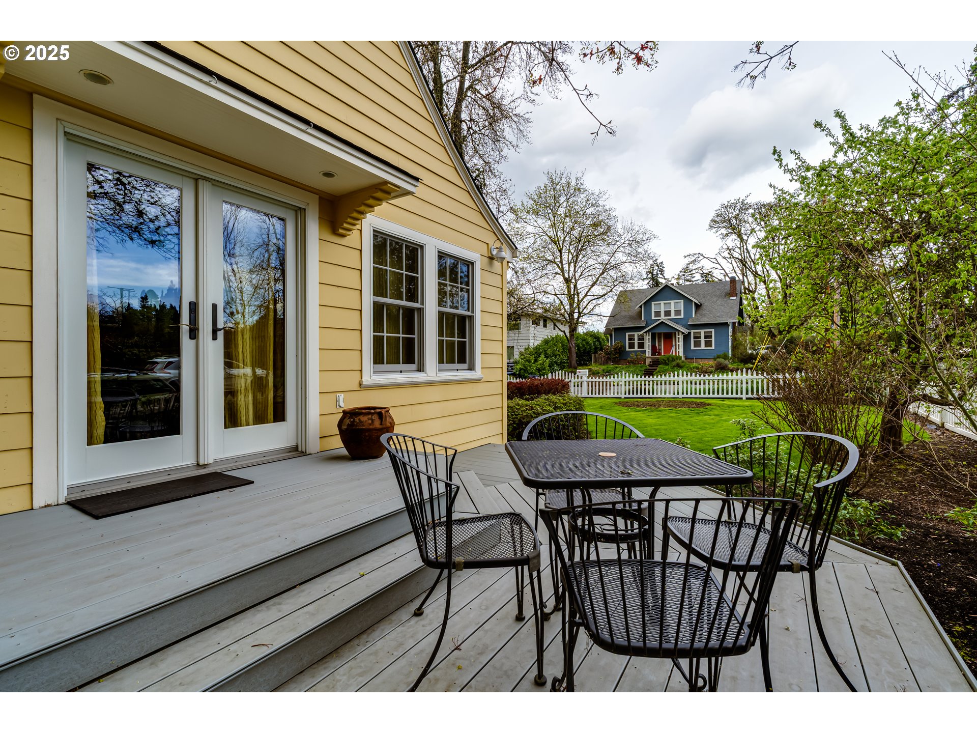 1996 Monroe Street Eugene, OR 97405 - Photo 38 of 47 a view of a chairs and table in patio with a wooden fence