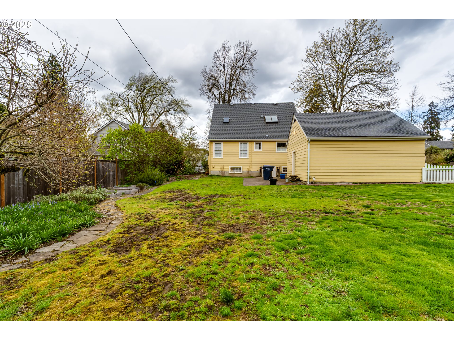 1996 Monroe Street Eugene, OR 97405 - Photo 44 of 47 a view of a house with a big yard and large trees