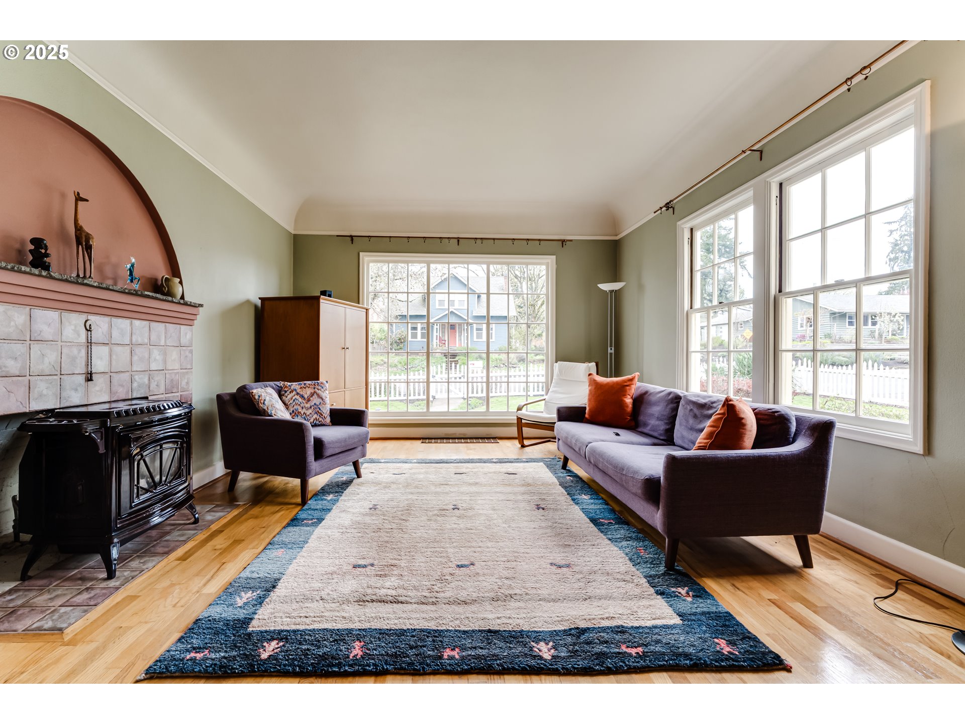 1996 Monroe Street Eugene, OR 97405 - Photo 7 of 47 a living room with furniture a fireplace and a flat screen tv