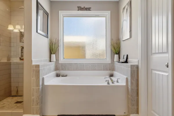 a bathroom with a bathtub and a sink
