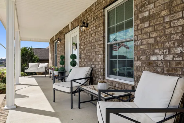a view of a patio with a table and chairs