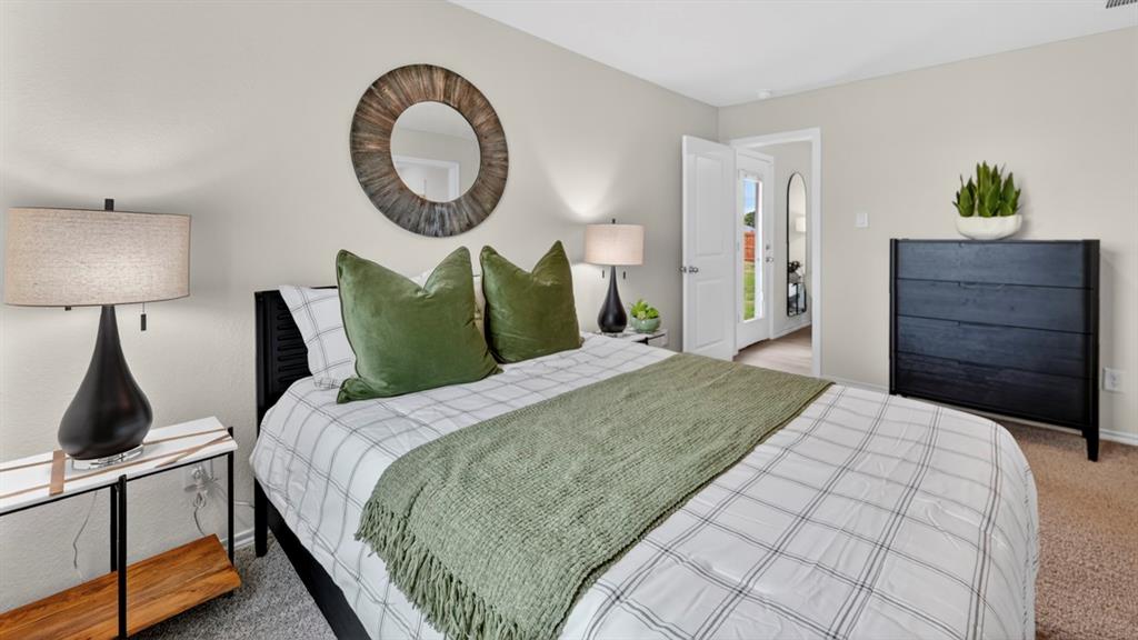 3514 Spring Time Street Terrell, TX 75126 - Photo 16 of 26 Carpeted bedroom featuring light-toned walls and a black slatted headboard