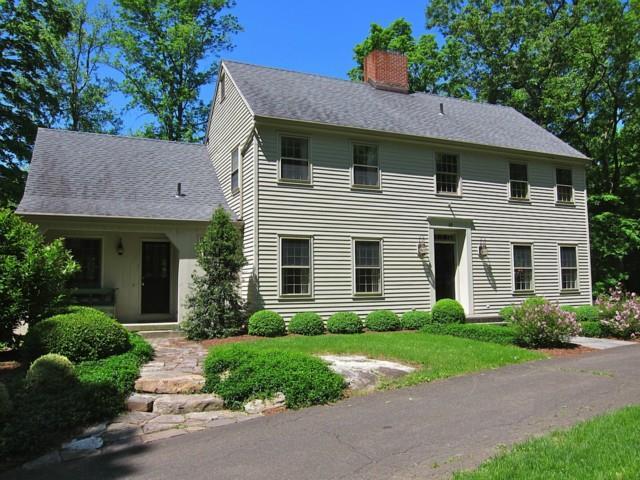 10 Red Oak Lane Ridgefield, CT 06877 - Photo 1 of 1 a front view of a house with a yard and garage